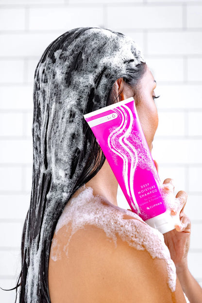 Model Holding Deep Moisture Shampoo for hair extensions